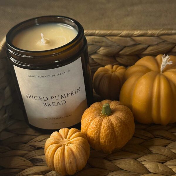 Autumn Harvest Glow soy jar candle with fall scents and a sealed lid