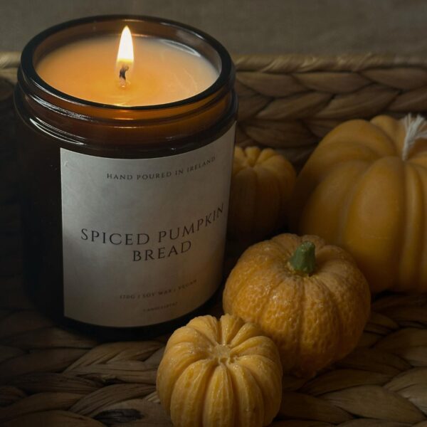 Autumn Harvest Glow soy jar candle with fall scents and a sealed lid